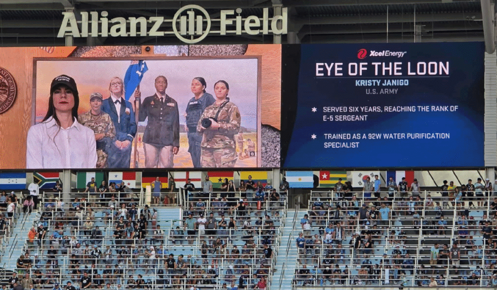 Photo of Kristy Janigo on the Jumbo Tron at Allianz Field receiving the Eye of the Loon recognition.