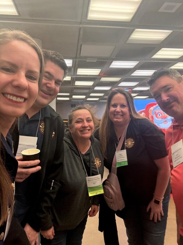 Photo of Kristy with conference attendees