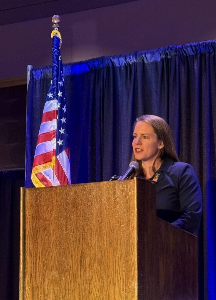 Photo of Kristy Speaking at the Allied Charities of MN conference